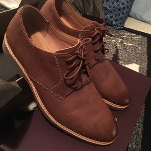 Brown leather dress shoes.